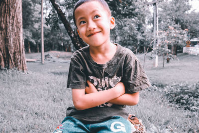 Portrait of smiling boy on field