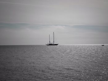 Sailboat sailing in sea