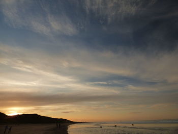 Scenic view of sea against sky at sunset