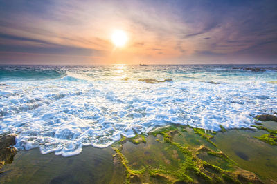 Scenic view of sea against sky during sunset