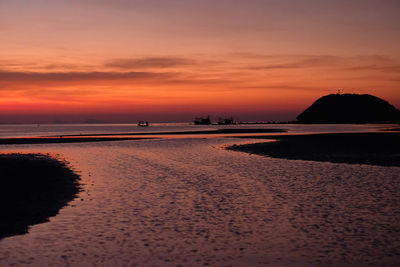Scenic view of beach against sky during sunset