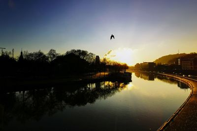 Scenic view of lake against sky during sunset