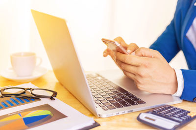 Man using laptop on table