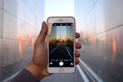 Woman photographing through smart phone