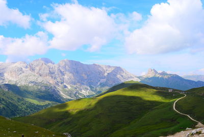 Scenic view of mountains against cloudy sky