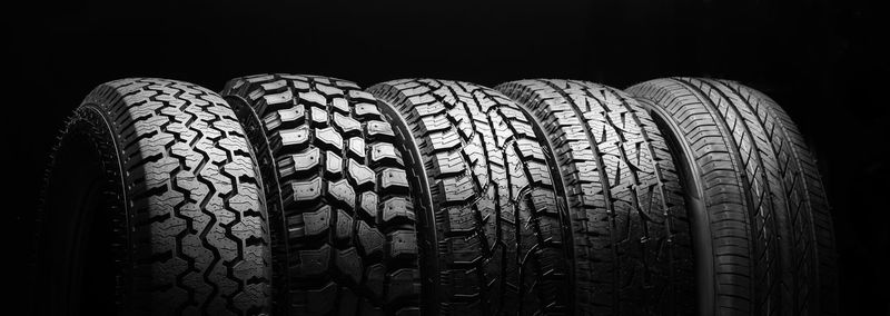 Close-up of tire against black background