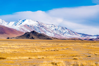 Scenic view of snowcapped mountains against sky