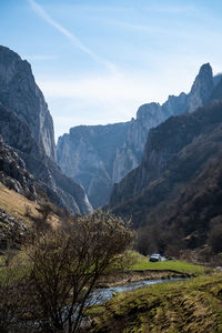 Scenic view of landscape and mountains against sky