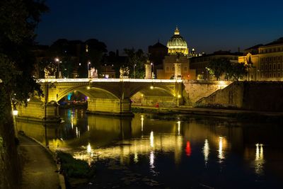 Bridge over river at night