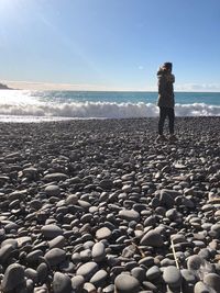 Full length of man standing on beach