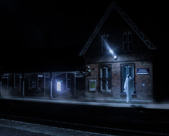 Illuminated abandoned building at night