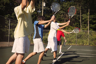 Midsection of woman playing tennis