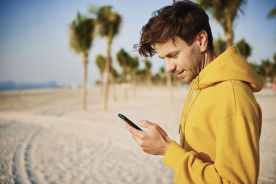 Young man using mobile phone