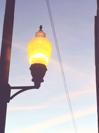 Low angle view of power lines against sky
