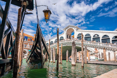 Traditional gondola near world famous canal grande and rialto bridge