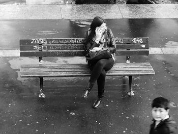 Full length of women sitting in park