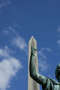 Low angle view of building against blue sky