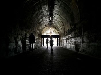 People walking in tunnel