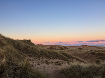 Scenic view of landscape at sunset