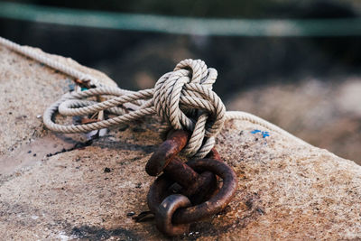 Close-up of rope tied on metal