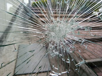 Close-up of broken glass window