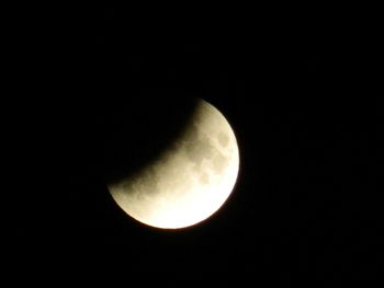 Low angle view of moon against sky at night