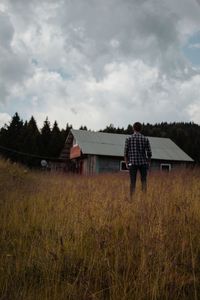 House on field against sky