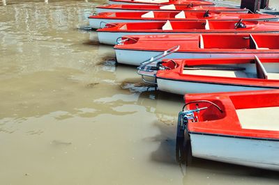 High angle view of red boats moored in lake