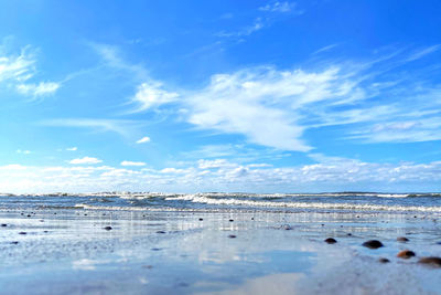 Scenic view of sea against blue sky