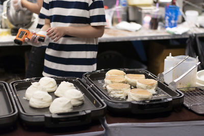 Close-up of man preparing food in kitchen