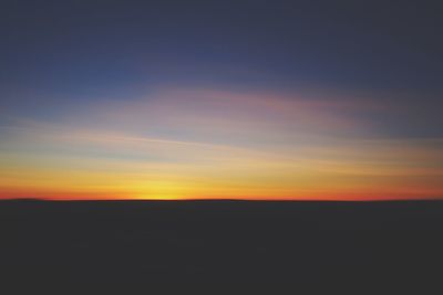 Scenic view of silhouette landscape against sky during sunset