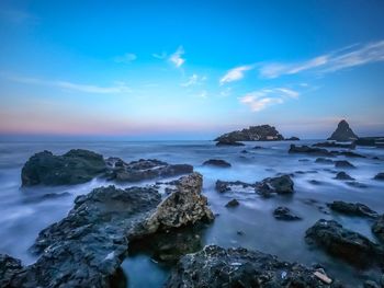 Scenic view of sea against sky during sunset
