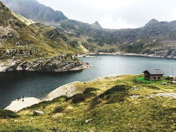 Scenic view of lake and mountains against sky