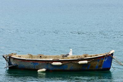 Boat moored in sea