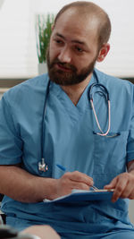 Nurse examining patient in clinic