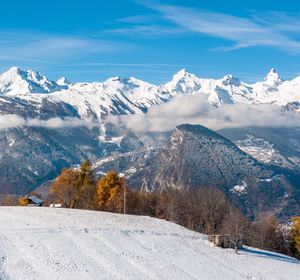 Scenic view of snowcapped mountains against sky