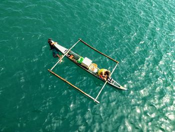 High angle view of people on boat in sea