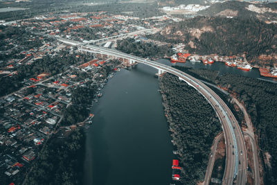 High angle view of bridge and buildings in city