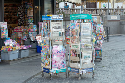 Newsagent's shop exterior, newsstands full of foreign daily newspapers