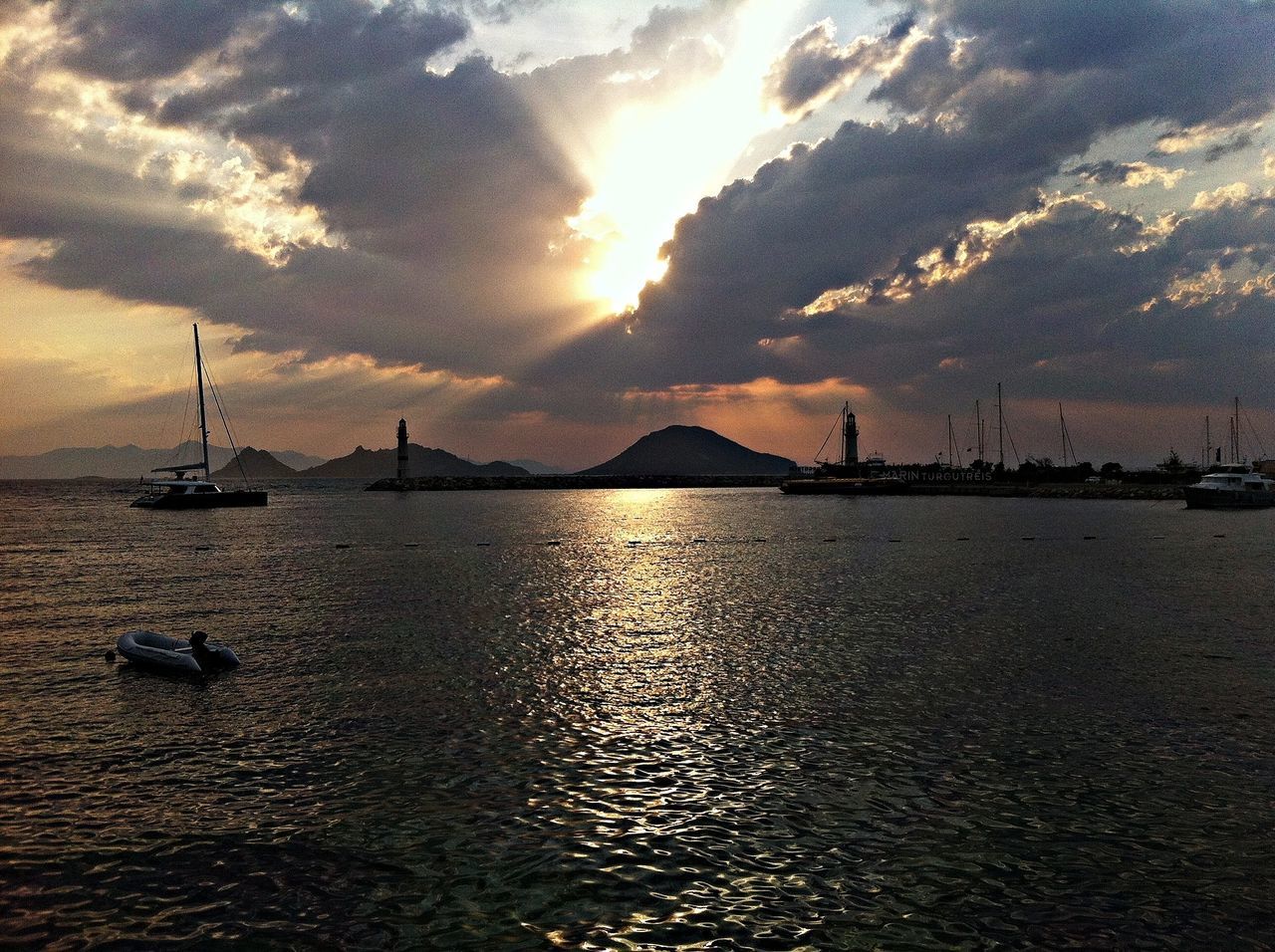 water, sea, sky, waterfront, sunset, transportation, scenics, cloud - sky, beauty in nature, tranquil scene, built structure, tranquility, nature, architecture, nautical vessel, rippled, river, cloud, outdoors, cloudy