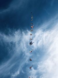 Low angle view of kites against sky