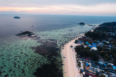 High angle view of beach against sky during sunset