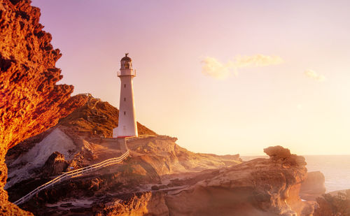 Dawn by sea against the sky was captured at castlepoint lighthouse, new zealand