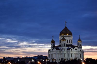 Illuminated cathedral of christ the saviour against cloudy sky during sunset