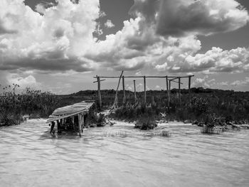 Bridge over river against sky