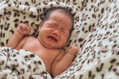 Cute baby sleeping on bed