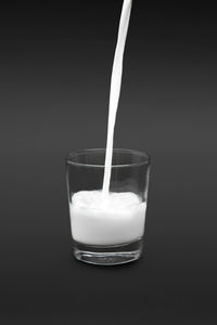 Close-up of drink over black background