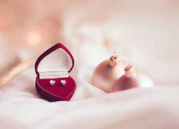 Close-up of wedding rings on table