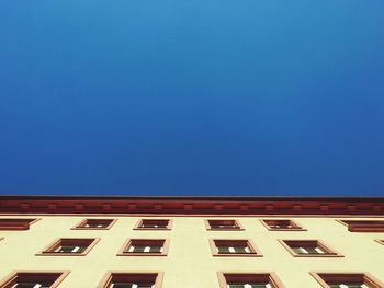 Low angle view of building against blue sky
