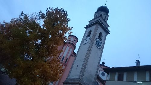 Low angle view of clock tower against sky